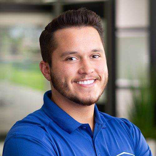 Smiling person in a blue shirt